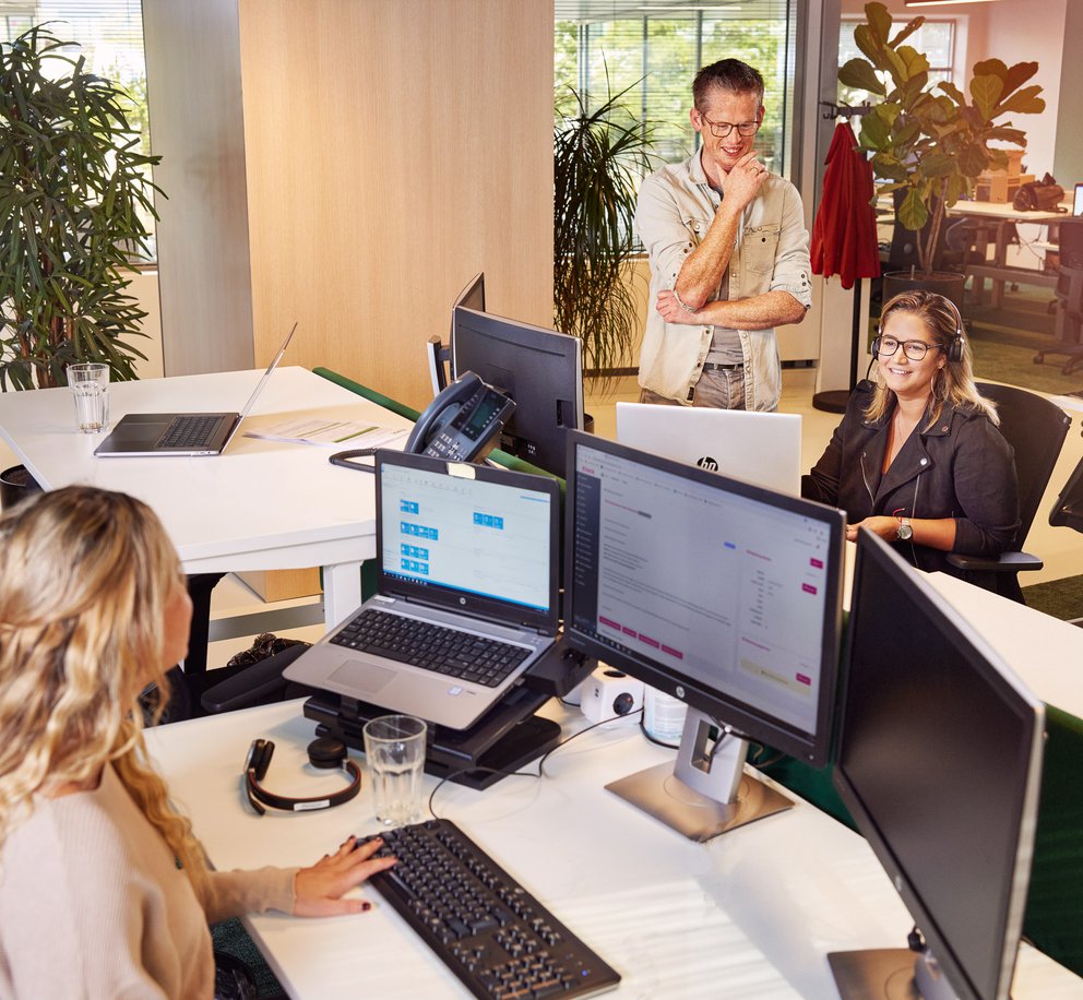 Foto van medewerkers van de afdeling Customer Care